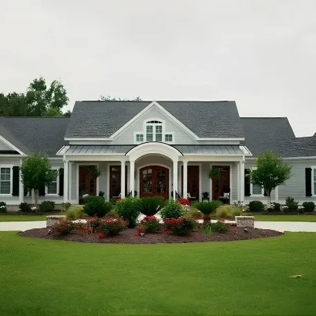 Large gray suburban house with landscaped lawn and circular driveway